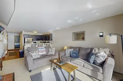 a living room with a couch and a table at Lakeview Peaks in Dillon