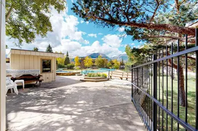 a home with a fence and a pool at Lakeview Peaks in Dillon