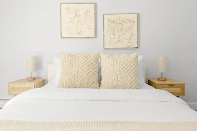 a bedroom with a white bed with two two lamps at Bright & Modern - King Suite - Creekside Trail in Boulder