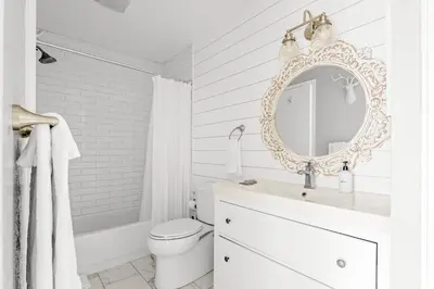 a white bathroom with a sink and a mirror at Bright & Modern - King Suite - Creekside Trail in Boulder