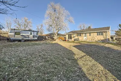 an rv parked in a yard next to a house at Spacious Denver home in Denver