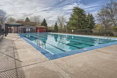 a large swimming pool in a yard at Spacious Denver home in Denver