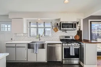 a kitchen with a sink and a stove at Spacious Denver home in Denver
