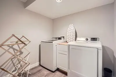 a laundry room with a washer and dryer at Spacious Denver home in Denver