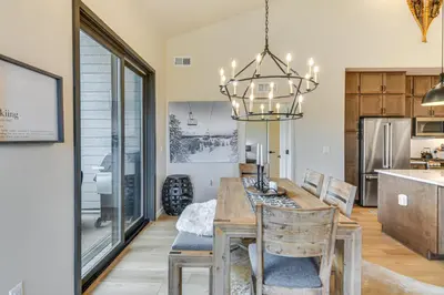 a dining room and kitchen with a table and chairs at 3 Mi to Winter Park Resort Mtn-View Haven! in Winter Park