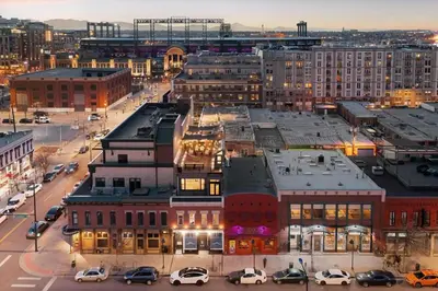 a city with cars parked in a parking lot at Suite No 1 in Denver