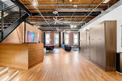 an office space with wood floors and a ceiling at Suite No 1 in Denver