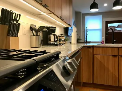 a kitchen with a stove top oven in a kitchen at R & R Hideaway in Grand Lake