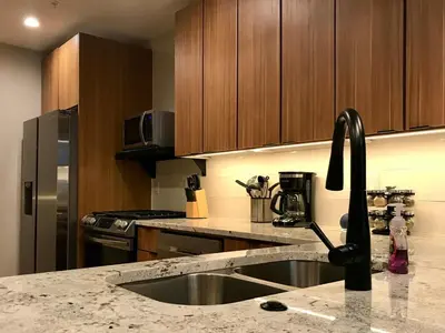 a kitchen with a sink and aaucet at R & R Hideaway in Grand Lake