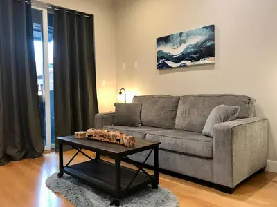 a living room with a couch and a coffee table at R & R Hideaway in Grand Lake