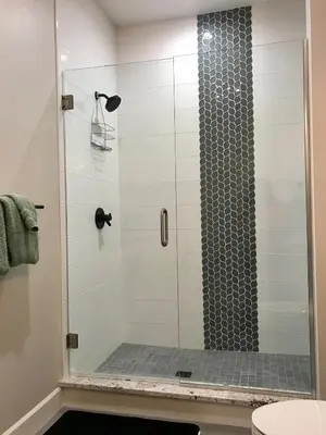 a shower with a glass door in a bathroom at R & R Hideaway in Grand Lake