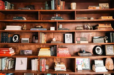 a book shelf filled with lots of books at Exquisite Craftsman - RiNo&Cole - Backyard Garden in Denver