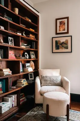 a living room with a chair and a book shelf at Exquisite Craftsman - RiNo&Cole - Backyard Garden in Denver