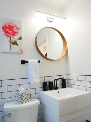 a bathroom with a white sink and a mirror at Entire House Kid Ready Yard in Arvada