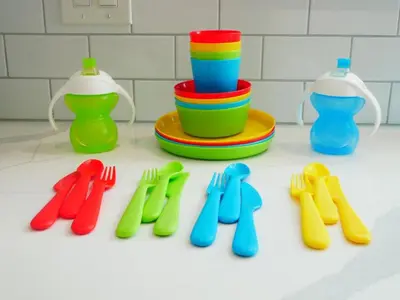 a group of colorful plastic utensils on a counter at Entire House Kid Ready Yard in Arvada