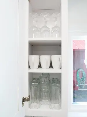 a cabinet filled with glass jars and bowls at Entire House Kid Ready Yard in Arvada