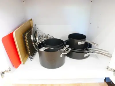 a group of pots and pans sitting on a shelf at Entire House Kid Ready Yard in Arvada