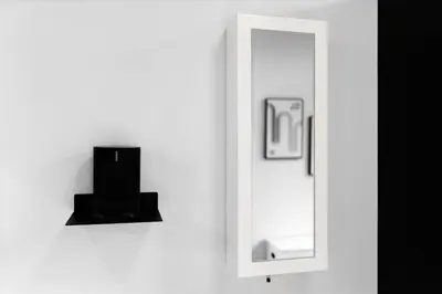 a mirror on a wall next to a white wall at Suite No 1 & No 2 in Denver