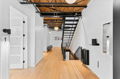 an empty hallway with a staircase in a building at Suite No 1 & No 2 in Denver