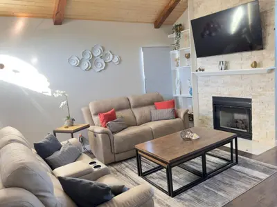a living room with a couch and a fireplace at Modern Haven Scenic Nature Views Near Chatfield Park in Littleton