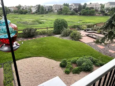 a view of a garden from a balcony at Modern Haven Scenic Nature Views Near Chatfield Park in Littleton