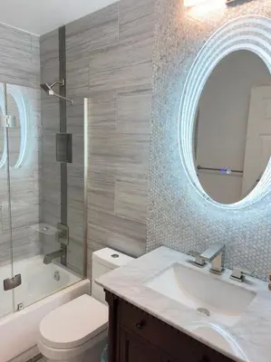 a bathroom with a sink and a toilet and a mirror at Modern Haven Scenic Nature Views Near Chatfield Park in Littleton