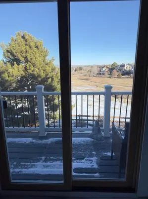 a view from a window of a porch with snow at Modern Haven Scenic Nature Views Near Chatfield Park in Littleton
