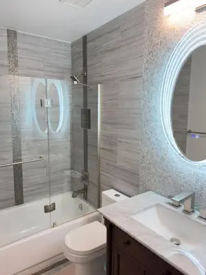 a bathroom with a toilet and a sink and a mirror at Modern Haven Scenic Nature Views Near Chatfield Park in Littleton
