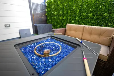 a table with a baseball bat and a ring on it at Spacious 4BD Near Denver w BBQ, Game Room & Office in Commerce City