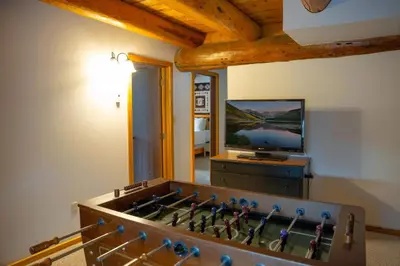 a chess board in front of a television in a room at Silverthorne Cabin with Hot Tub and Forest Access in Silverthorne