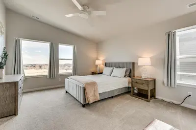 a bedroom with a bed and two windows at Hike, Bike and More Superior Home 3 Mi to Parks! in Superior