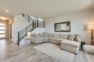 a living room with a couch and a staircase at Hike, Bike and More Superior Home 3 Mi to Parks! in Superior