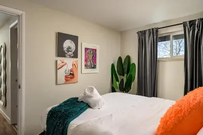 a bedroom with a bed with a stuffed animal on it at Huge Hot Tub, Theater Room, Family Friendly Oasis in Arvada