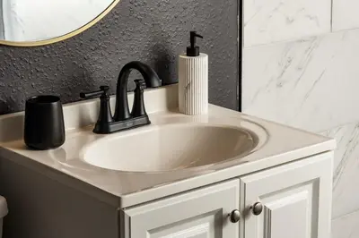 a bathroom with a sink and a mirror at Huge Hot Tub, Theater Room, Family Friendly Oasis in Arvada