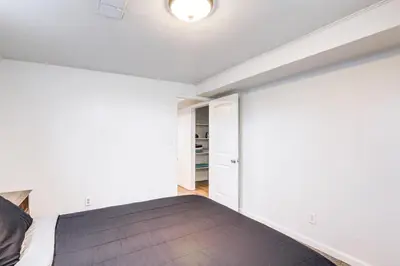 a bedroom with a large bed and a closet at 8 Mi to Dtwn Denver Haven with Patio and Yard! in Denver