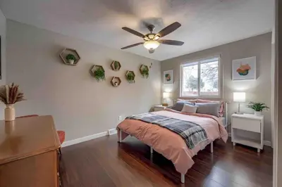 a bedroom with a bed and a ceiling fan at 4BR Longmont Escape with Cold Plunge & Sauna - Pets OK! in Longmont