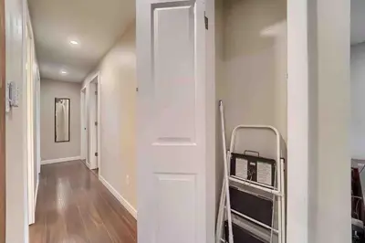 a room with a hallway with a room with a refrigerator at 4BR Longmont Escape with Cold Plunge & Sauna - Pets OK! in Longmont