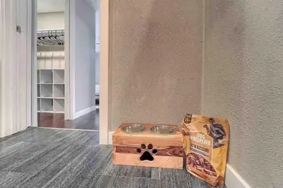 a wooden crate with a dog bowl in a room at 4BR Longmont Escape with Cold Plunge & Sauna - Pets OK! in Longmont