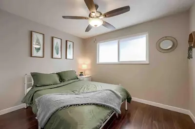 a bedroom with a bed and a ceiling fan at 4BR Longmont Escape with Cold Plunge & Sauna - Pets OK! in Longmont