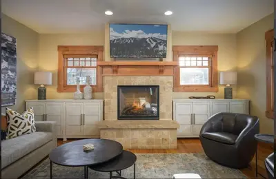 a living room with a fireplace and a couch at Luxe Winter Park Escape - 5BR with Hot Tub & Game Room in Winter Park