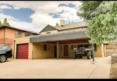 a garage with a jeep parked inside of it at Cherry Creek Colorado in Denver