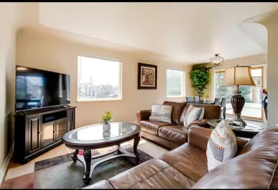 a living room with a couch and a coffee table at Cherry Creek Colorado in Denver