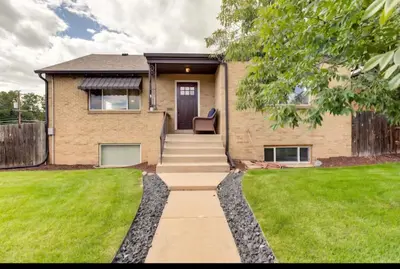 a house with a walkway leading to the front door at Cherry Creek Colorado in Denver