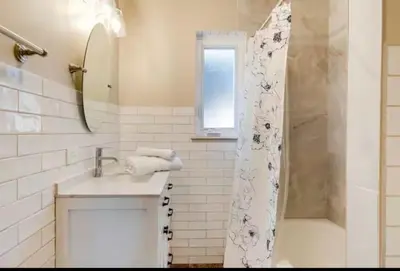 a bathroom with a shower and a sink and a shower curtain at Cherry Creek Colorado in Denver