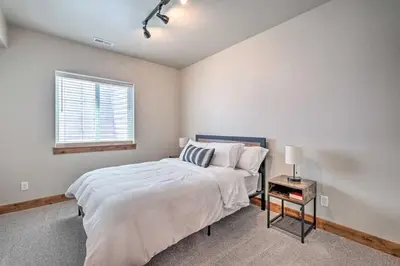 a bedroom with a bed and a window at Quiet Family Friendly 3 BR Near Loveland DT in Loveland