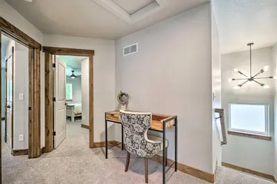 a dining room with a table and a chair at Quiet Family Friendly 3 BR Near Loveland DT in Loveland