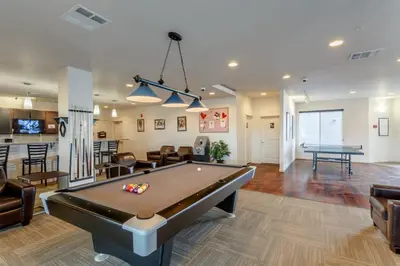 a living room with a pool table in it at Central Urban Stay with Gym in Greeley