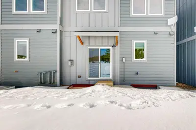 a house with snow in front of it at Tabernash Escape in Tabernash
