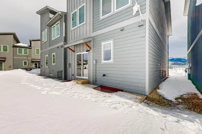 a house with snow on the ground in front of it at Tabernash Escape in Tabernash