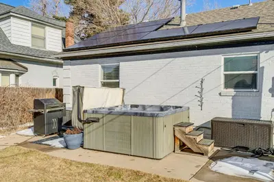 a house with a hot tub in the yard at Walk to City Park Chic Home with Hot Tub and Yard in Denver